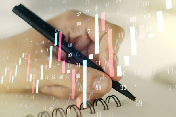 istock Double exposure of abstract creative financial diagram with hand writing in notebook on background, banking and accounting concept 1221737922