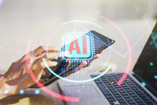 istock Double exposure of creative artificial Intelligence abbreviation and hand working with a digital tablet on background. Future technology and AI concept 1221738106