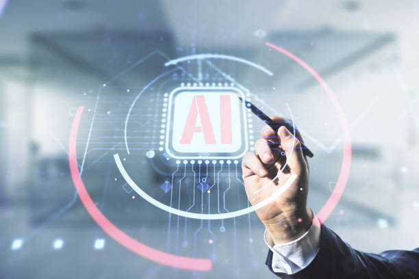 istock Double exposure of businessman hand with pen working with creative artificial Intelligence abbreviation hologram on blurred office background. Future technology and AI concept 1221738109