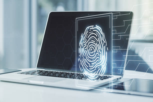 istock Multi exposure of creative fingerprint hologram on laptop background, personal biometric data concept 1221738816