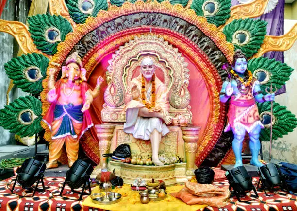 Photo of Indian Hindu God Shirdiwale Sai Baba Blessing Stone idol in Hindu Spiritual temple, Regarded by his Devotees as a Saint.