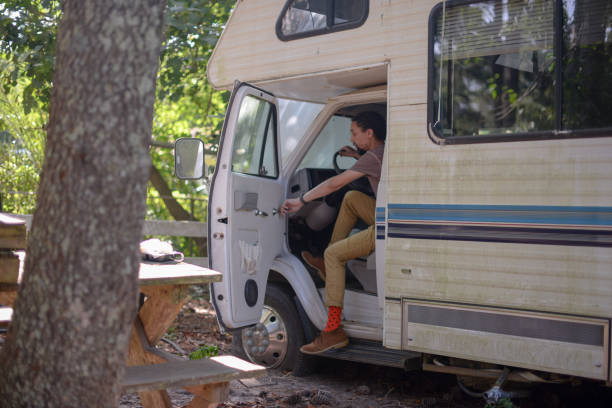 istock Man getting out of recreational vehicle 1221739988