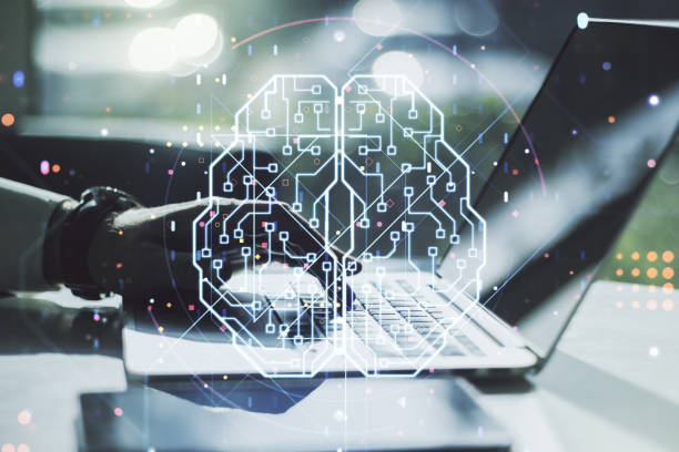 istock Double exposure of creative artificial Intelligence symbol with hands typing on laptop on background. Neural networks and machine learning concept 1221740772