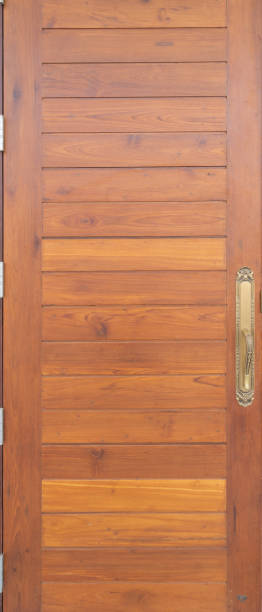 istock Natural wood slats door or lath line arrange patter. Flooring pattern surface texture. Close-up of interior architecture material for design decoration background. 1221741054