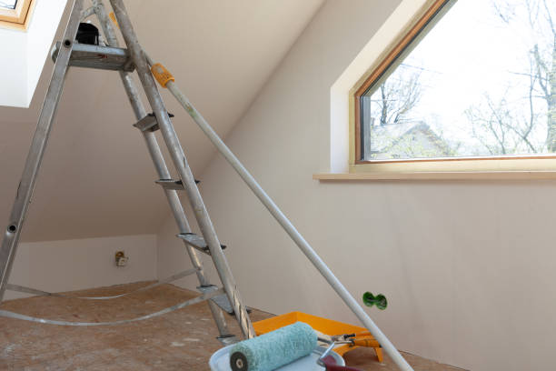 istock Home improvement. Painting tools roller, paint bucket and paintbrush in a natural light. 1221743076