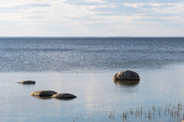 istock Coastal view with rocks in calm water 1221743771