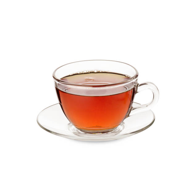istock Tea Cup and glass saucer with black made liquid tea isolated on white background 1221744099