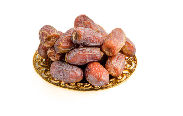 istock Date fruits or dry dates isolated on white background. 1221748300