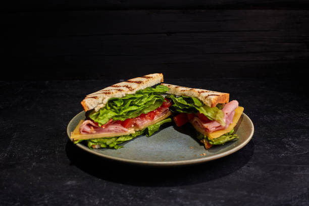 istock Sandwiches on the plate. Dark background. 1221750508