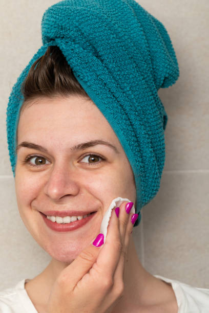istock Woman cleaning her face in the bathroom 1221751646