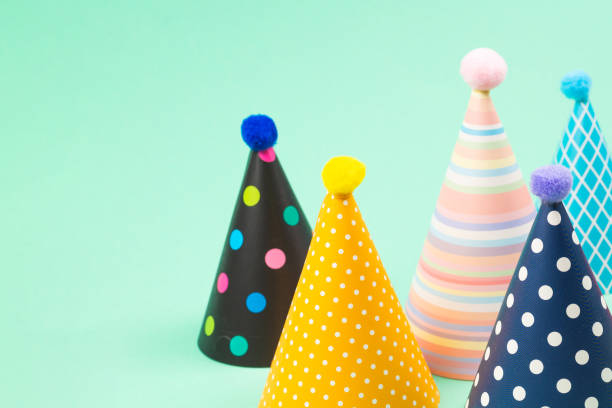 istock Colorful birthday caps on mint background. 1221753096