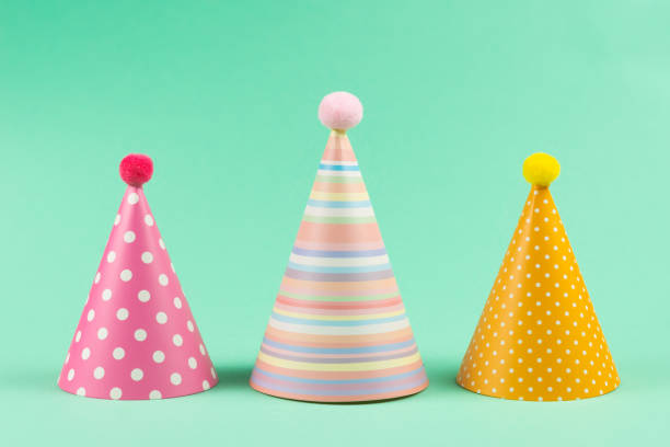 istock Colorful birthday caps on mint background. 1221753100