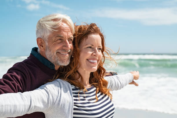 istock Romantic mature couple enjoying beach 1221754718