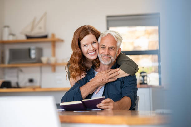 istock Senior happy couple embracing at home 1221754789