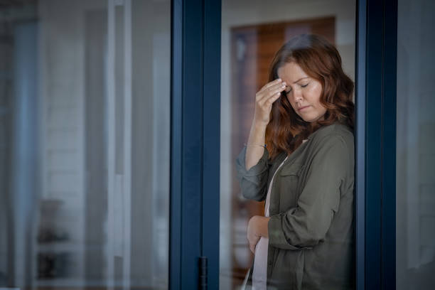 istock Stressed mature woman having headache 1221754837