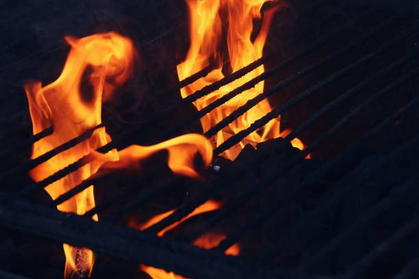 istock Charcoal barbecue lit with flames and embers. 1221755426
