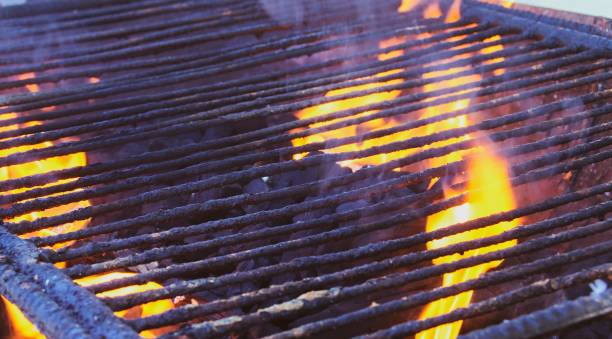 istock Charcoal barbecue lit with flames and embers. 1221755432