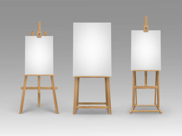istock Set of Brown Wooden Easels with Blank Canvases 1221755790