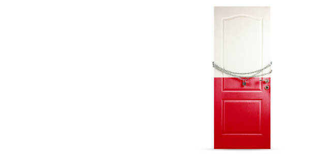 istock Door colored in Poland flag, locking with chain. Countries lockdown during coronavirus, COVID spreading 1221756542