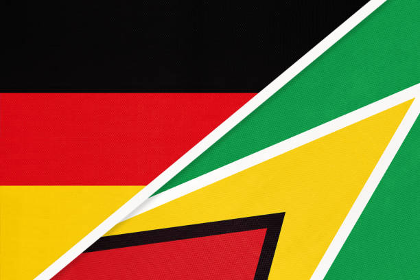 istock Germany vs Guyana, symbol of two national flags. Relationship between european and american countries. 1221757140