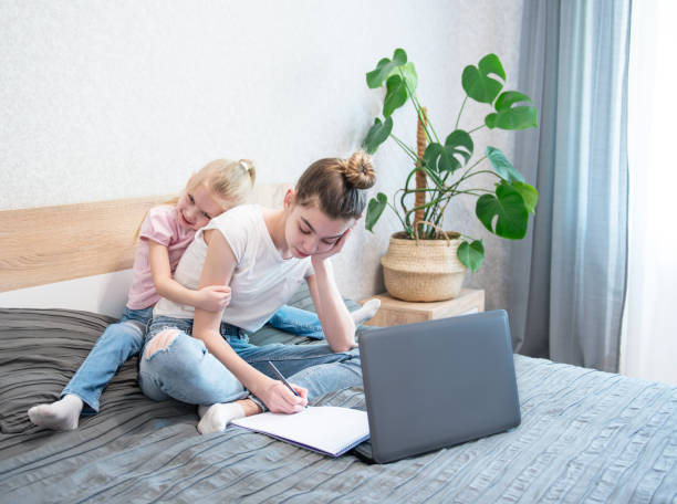 istock Schoolgirls  studing at home 1221758303