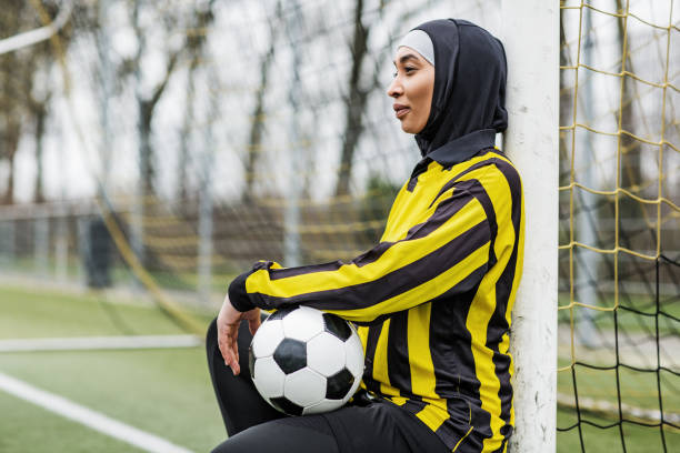 istock Beautiful Young Female Muslim Soccer Player 1221759095