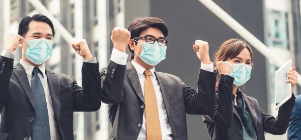 istock Confident business people with face mask protect from Coronavirus or COVID-19. 1221759375