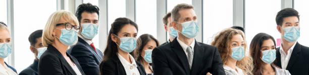 istock Confident business people with face mask protect from Coronavirus or COVID-19. 1221759382