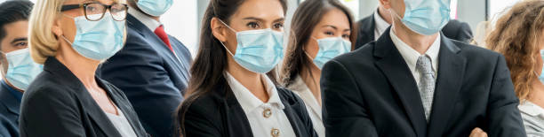 istock Confident business people with face mask protect from Coronavirus or COVID-19. 1221759398