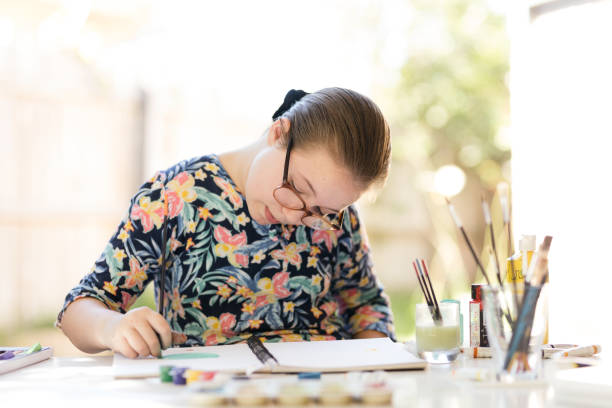 istock Young Girl Doing Art In Back Garden 1221759474