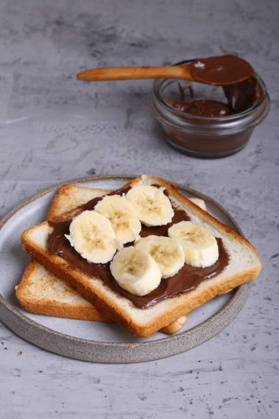 istock toast with chocolate paste and banana 1221759584