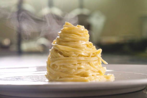 istock Egg pasta dish, typical Italian, with fine white truffle grated on top 1221759657