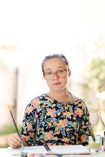 istock Young Girl Doing Art In Back Garden 1221759707