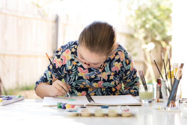 istock Young Girl Doing Art In Back Garden 1221759759