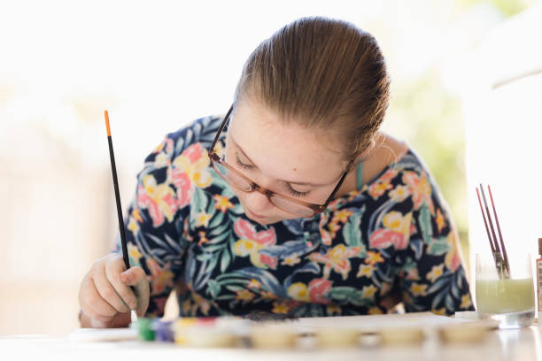 istock Young Girl Doing Art In Back Garden 1221760989