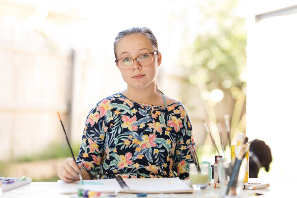 istock Young Girl Doing Art In Back Garden 1221761144