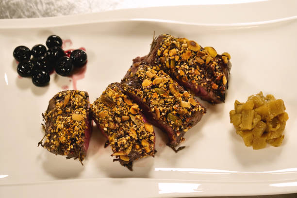 istock A chef, in a professional kitchen, cooked a tender tenderloin of meat. 1221761565