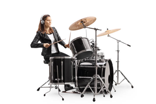 istock Young woman playing drums with headphones 1221762406