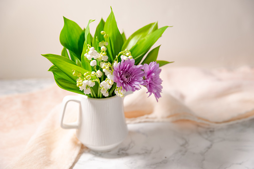 Bouquet of Lilies of the Valley isolated on marbel background