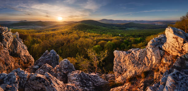 istock Sunset landscape panorame with spring forest - Tribec, Slovakia 1221765689