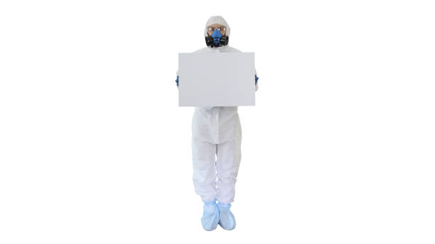 istock Lab scientist in safety suit holding empty white board on white background 1221768529