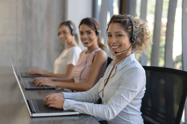 istock Happy group of women working at a call center 1221770026