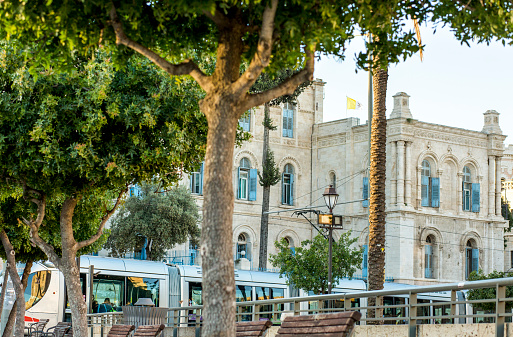 Jerusalem, Israel May 8, 2019: Israeli light rail in front of the St. Louis French Hospital at Tzahal Square in Jerusalem Old City, Israel