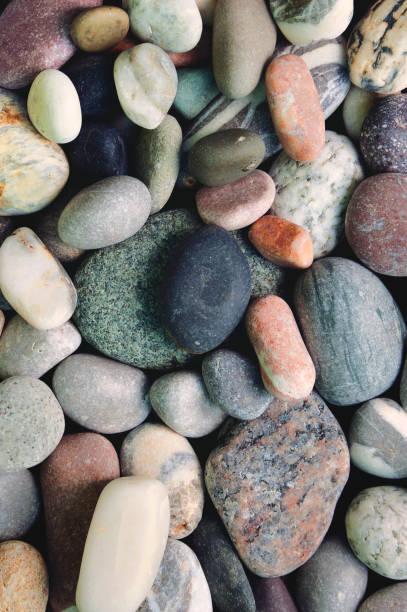 istock Pebble stones background and texture. Vertical photo. 1221771486