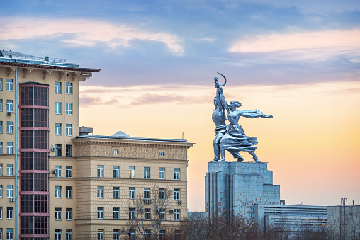 Monument Worker and Collective Farm Girl in Moscow against the sunset sky and a residential building