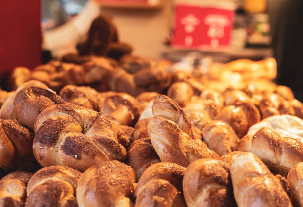 istock Fresh baked bread cakes buns in bakery store closeup 1221775777