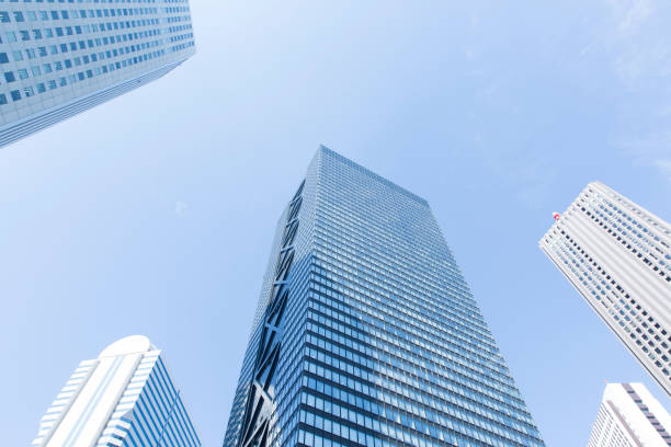 istock Looking up at skyscrapers sunny day 1221776448