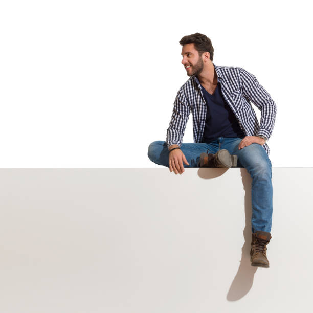 istock Relaxed Handsome Man Sits On A Top And Looks Away 1221776561
