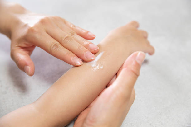istock putting cream on infant's arm 1221776700