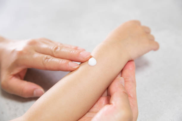 istock putting cream on infant's arm 1221777735